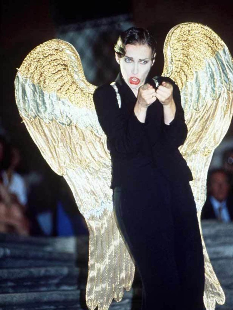 <p><a href="http://www.elleuk.com/content/search?SearchText=Annie+Lennox&amp;SearchButton=Search">Annie Lennox</a> rocks a trouser suit with wings performing with The Eurythmics in Rome, in 1992</p>