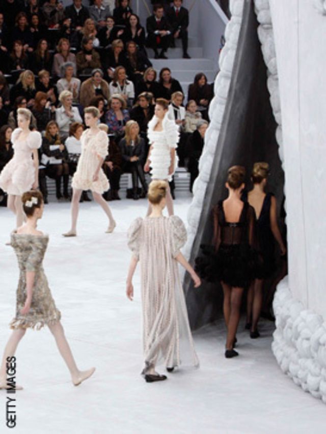 <p>This iconic vision set the tone for much of the show - a masterclass in Chanel suiting from Karl Largerfeld, who seemed to be inspired by everything from the sea (think scalloped hem skirts and star-fish buttons) to nature, cue feather edges on sheer s