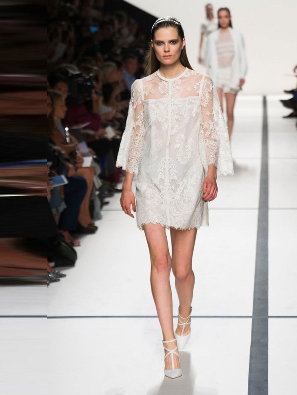 <p><a href="http://www.elleuk.com/catwalk/designer-a-z/elie-saab/spring-summer-2014/collection">Elie Saab</a>, Spring/ Summer 2014.</p><p>A bell-sleeved babydoll, swathed in lace for an extra dose of prettiness. Combine with softly, undone hair and sooty 