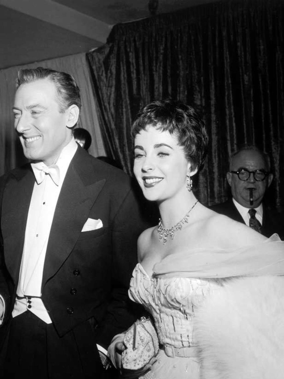 <p><a href="http://www.elleuk.com/fashion/special-features/bridal-icons">Elizabeth Taylor</a> with her second husband, British actor Michael Wilding, at the Academy Awards in 1954</p>