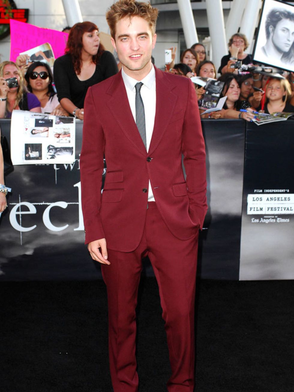 <p>Robert Pattinson wearing a maroon Gucci suit </p>