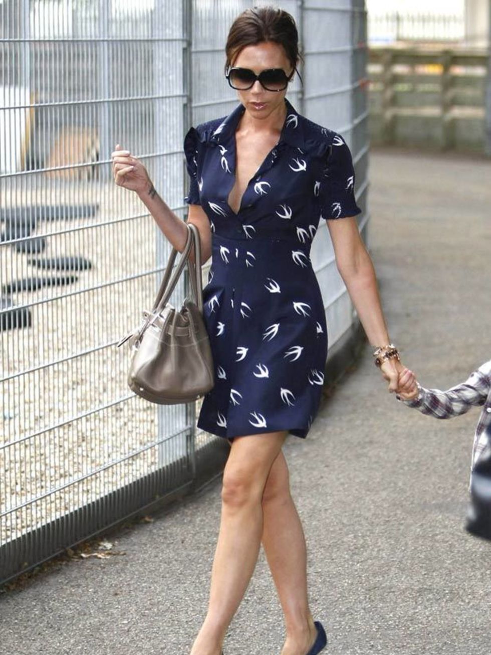 <p>Victoria Beckham in a Miu Miu dress</p>