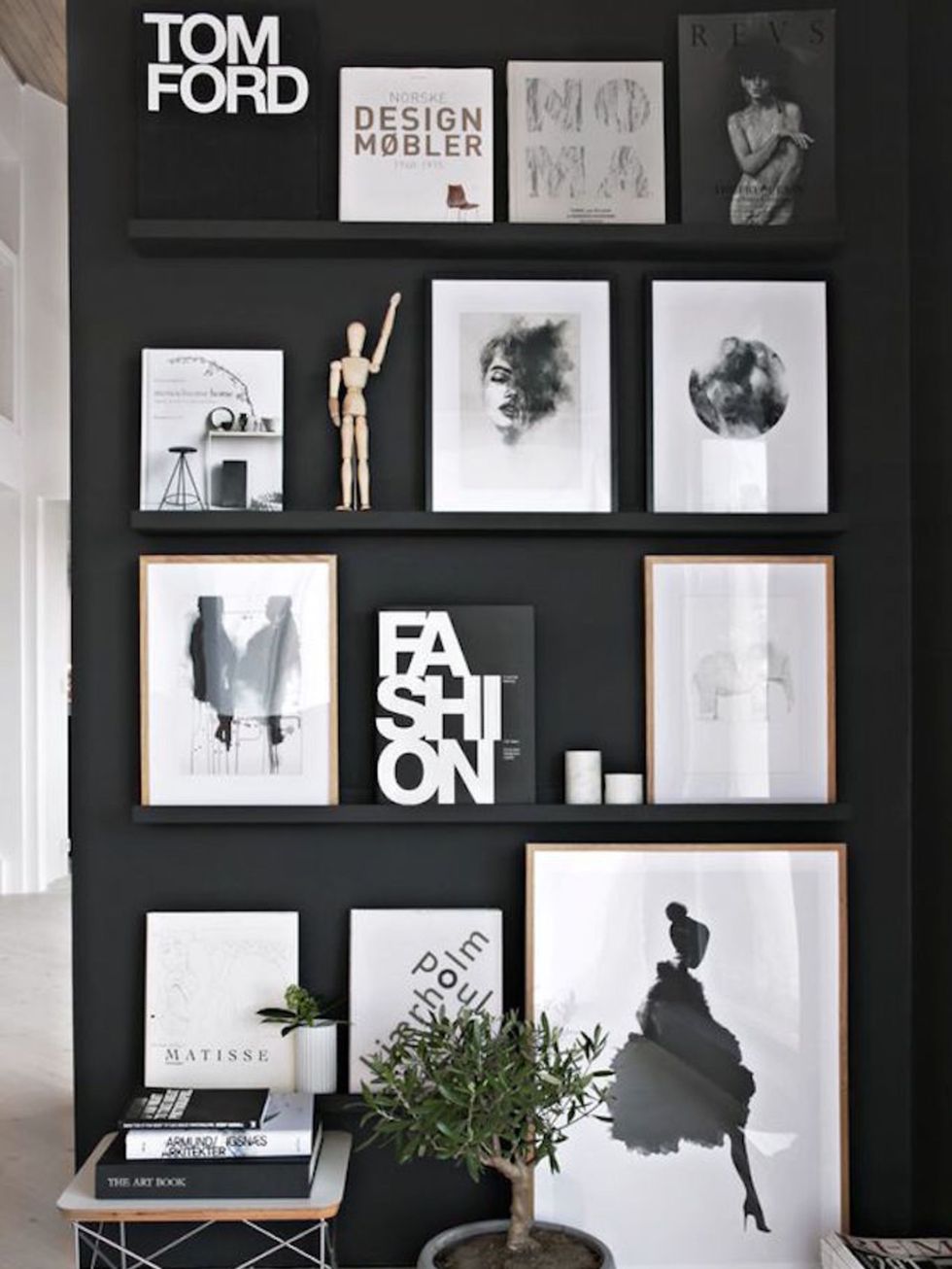 <p>Fashion bibles a-plenty? A simple black wall and a set of shallow floating shelves is all you need.&nbsp;</p>