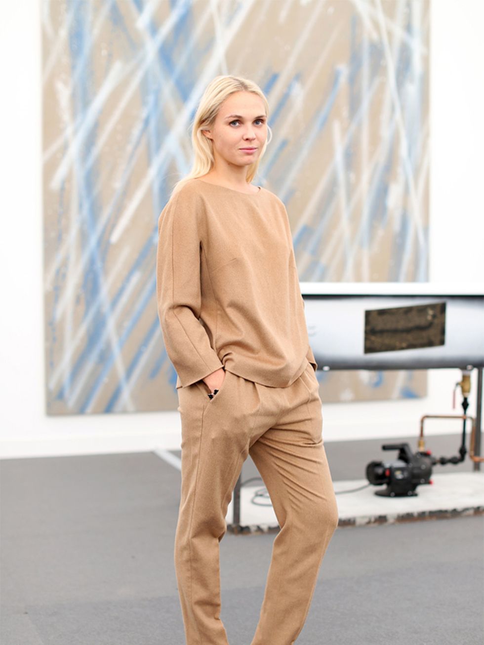 Victoria Latysheva wears Max Mara top and trousers, Zara shoes.