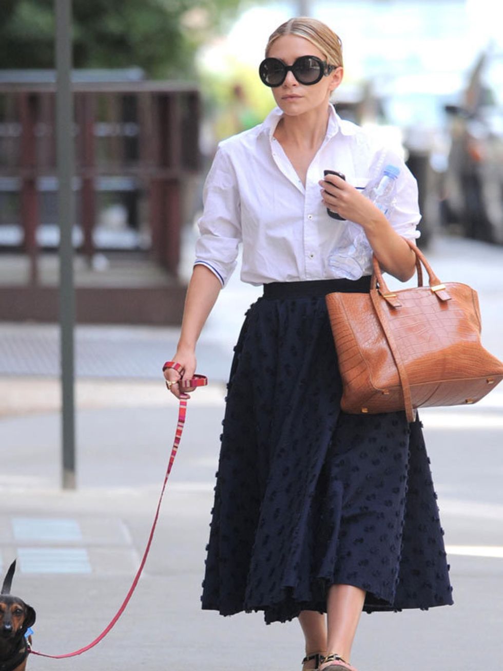 <p><a href="http://www.elleuk.com/starstyle/style-files/(section)/ashley-olsen">Ashley Olsen</a> channelling an understated ladylike look with a white shirt, statement skirt and <a href="http://www.elleuk.com/catwalk/collections/prada/spring-summer-2011/r