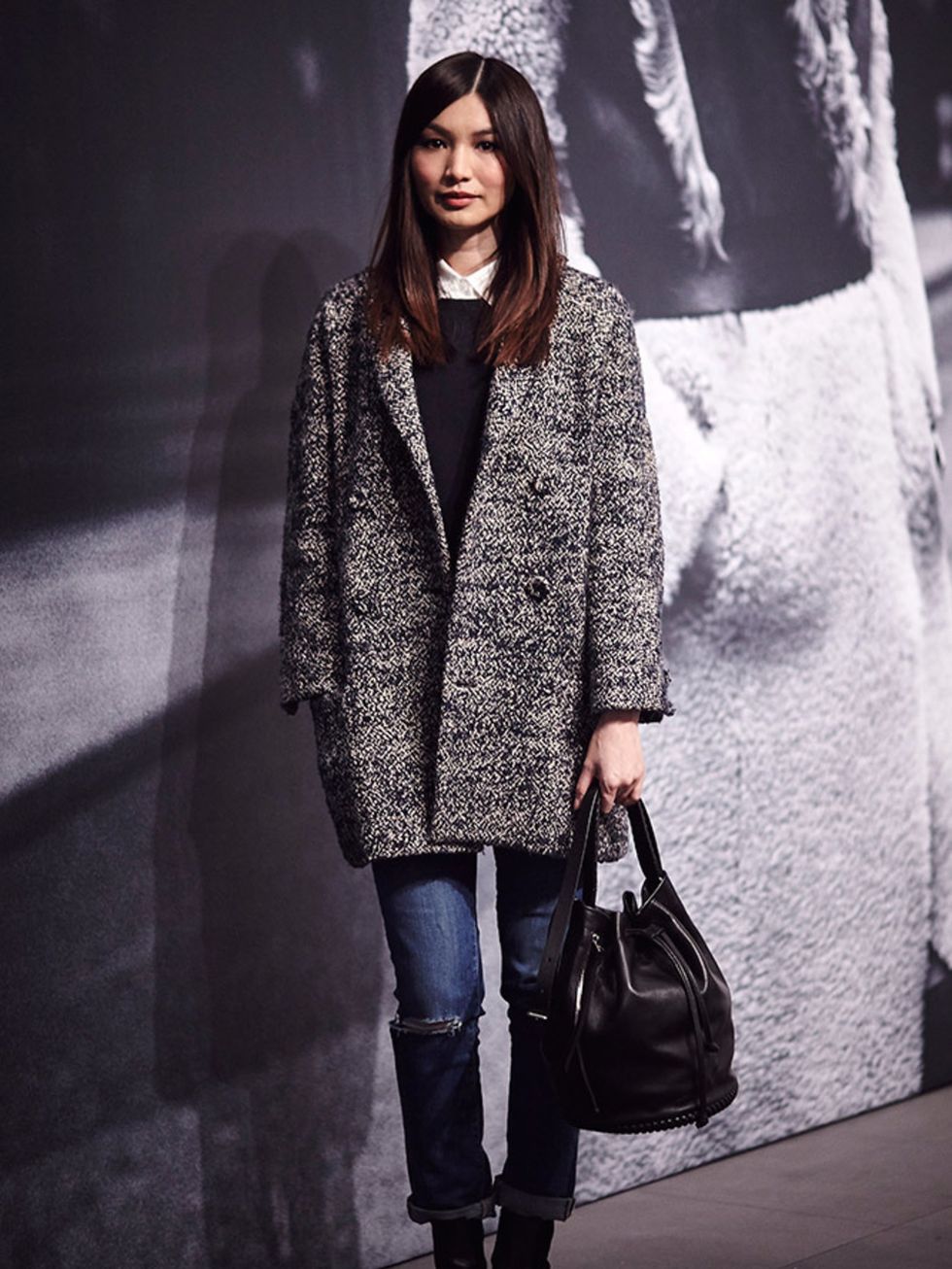 Gemma Chan carrying AllSaints bag at the London Fashion Week.