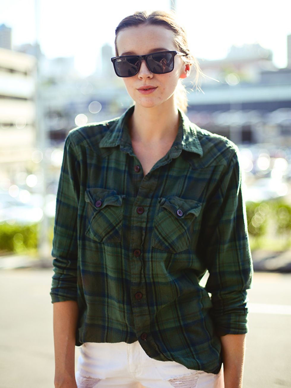 <p>Hannah wears a NastyGal vintage shirt, Bing Harris & Co shorts and Le Specs sunglasses.</p>