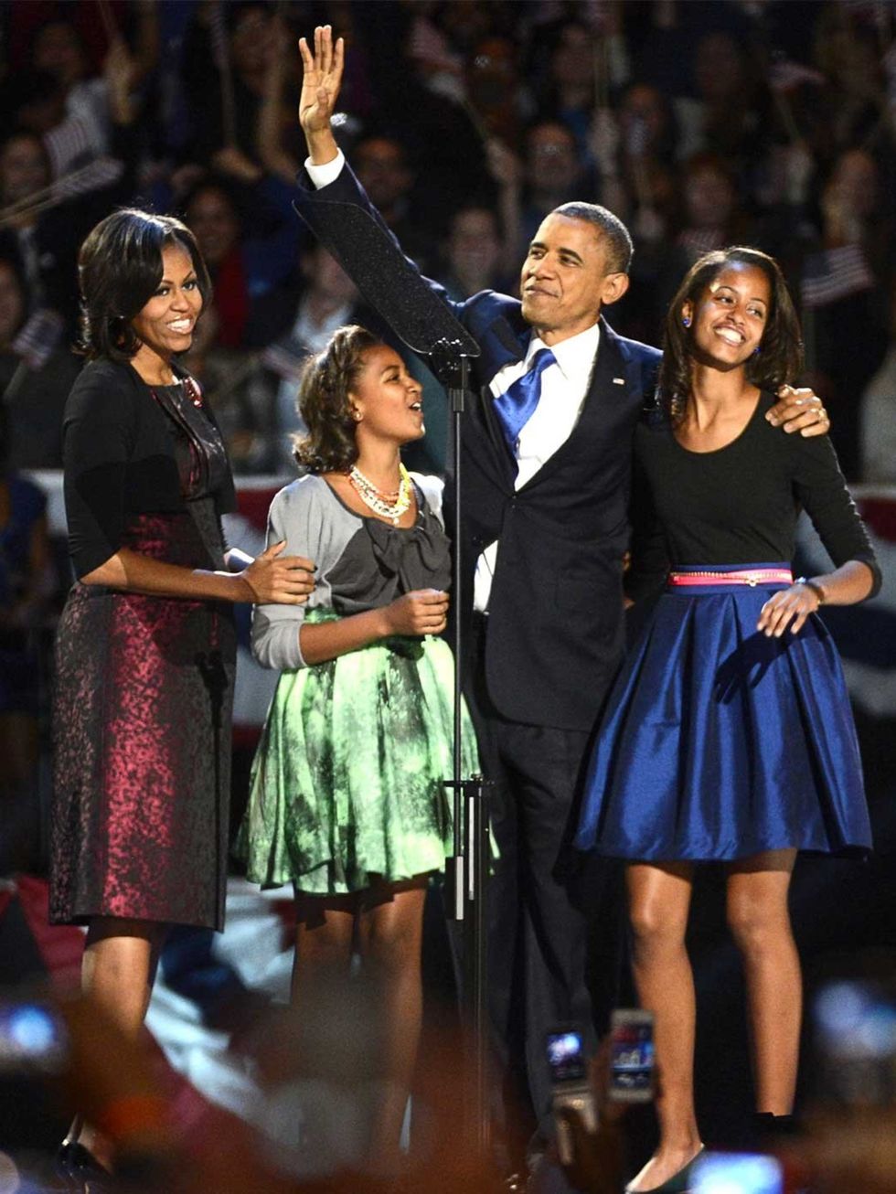 <p>Michelle Obama celebrates President Obama's victory in Michael Kors</p>