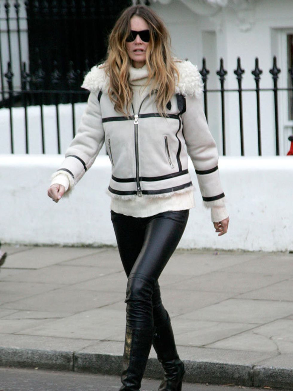 <p>Elle Macpherson wears an <a href="http://www.elleuk.com/catwalk/collections/isabel-marant/spring-summer-2011/collection">Isabel Marant</a> shearling suede jacket and boots for the school run, 25 November 2010 </p>
