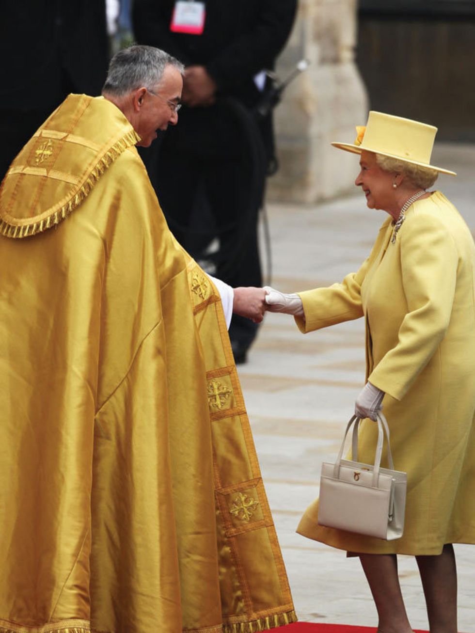 <p>The Queen wearing a goegoues yellow Angela Kelly outfit</p>