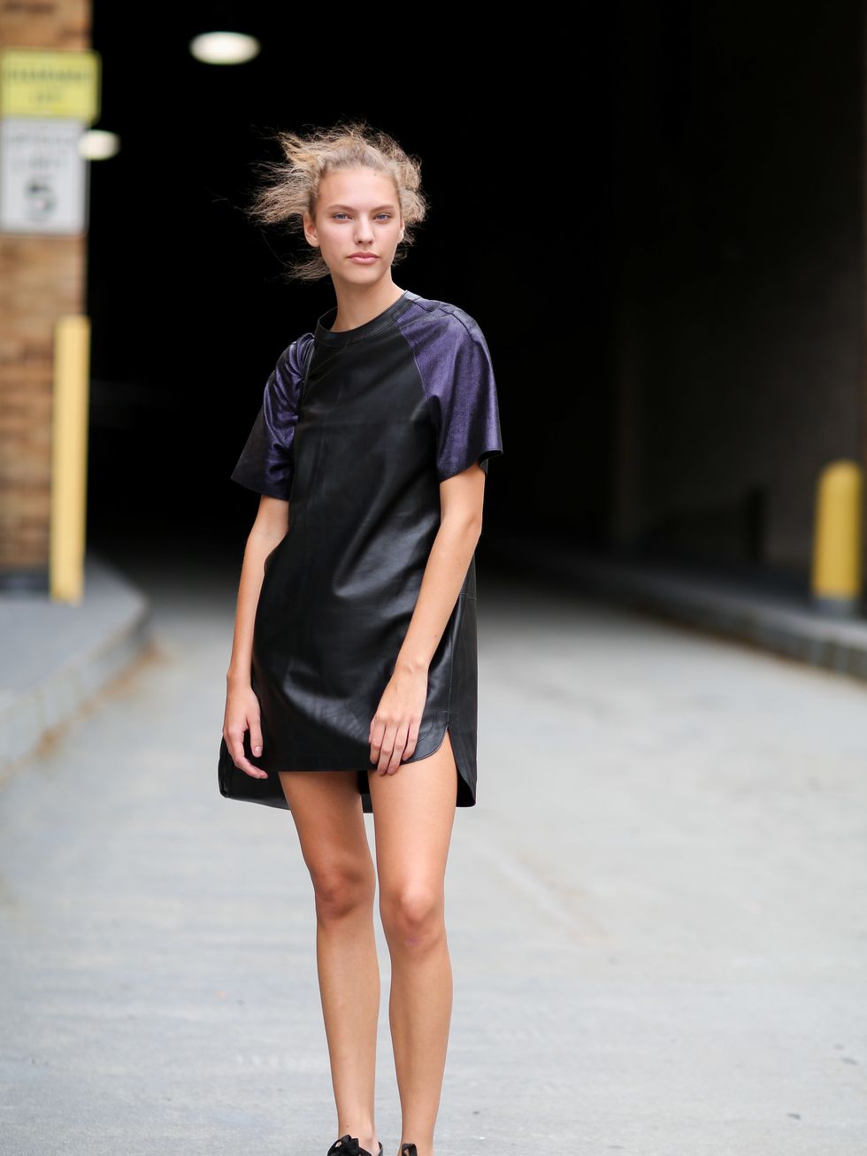 <p>Maggie Jablonski wears 3.1 Phillip Lim dress and shoes and Coach bag.</p>
