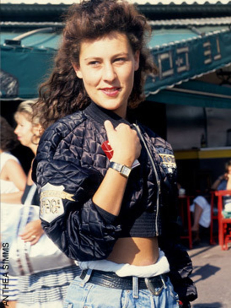 <p>We love how this girl has cinched in her oversized jeans and paired them with a quilted nylon bomber. Patches, on jackets and jeans were a big trend in the eighties.</p>