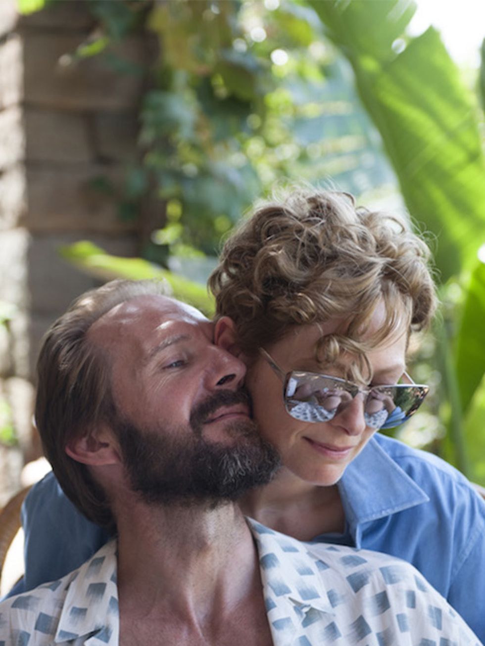 <p>Ralph Fiennes plays the exuberant/overbearing Harry, Marianne's former lover and manager, who descends (uninvited) on their hideaway with new-found troubled teen daughter, Pen, (Dakota Johnson) </p>