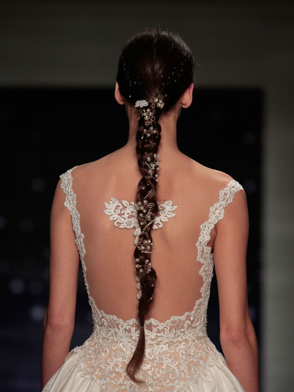 Uber-long braids were made opulent with pearls, crystals and lace at Reem Acra