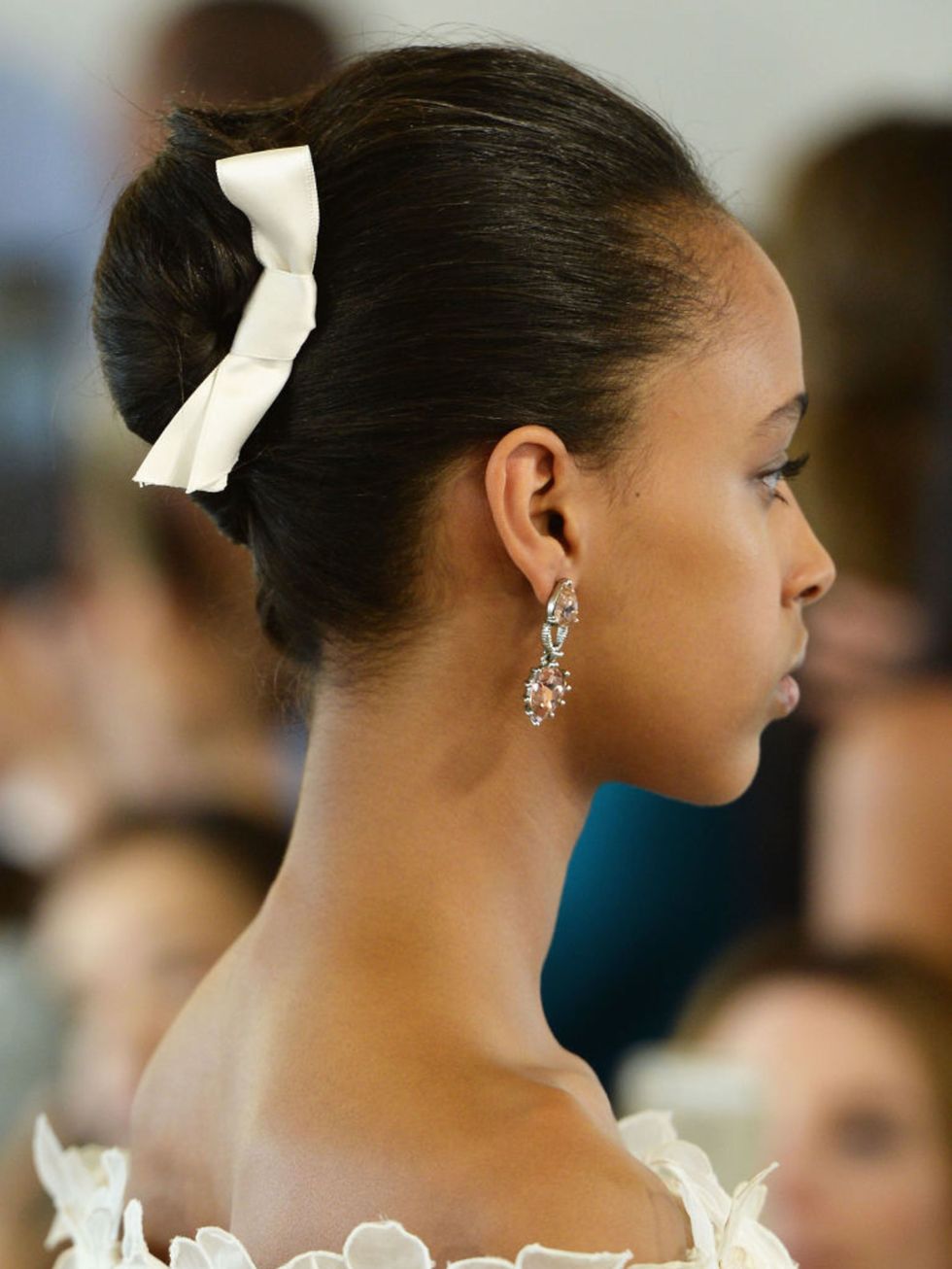 Another Oscar de le Renta model wore hers with a super-chic bow accessory  dare we say, a handy way to conceal bobby pins