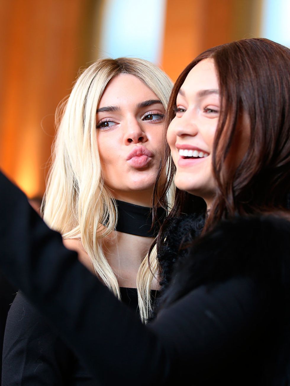 Gigi Hadid and Kendall Jenner backstage at the Balmain a/w 2016 show during Paris Fashion Week, March 2016.