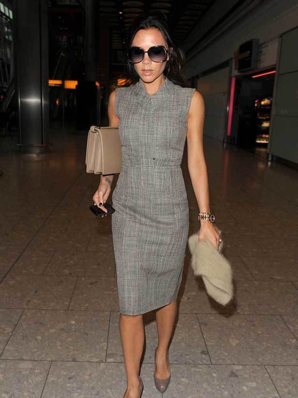 <p><a href="http://www.elleuk.com/starstyle/style-files/%28section%29/victoria-beckham">Victoria Beckham</a> wearing autumn winter 2010 <a href="http://www.elleuk.com/catwalk/collections/marc-jacobs/autumn-winter-2010/review">Marc Jacobs</a> with one of h