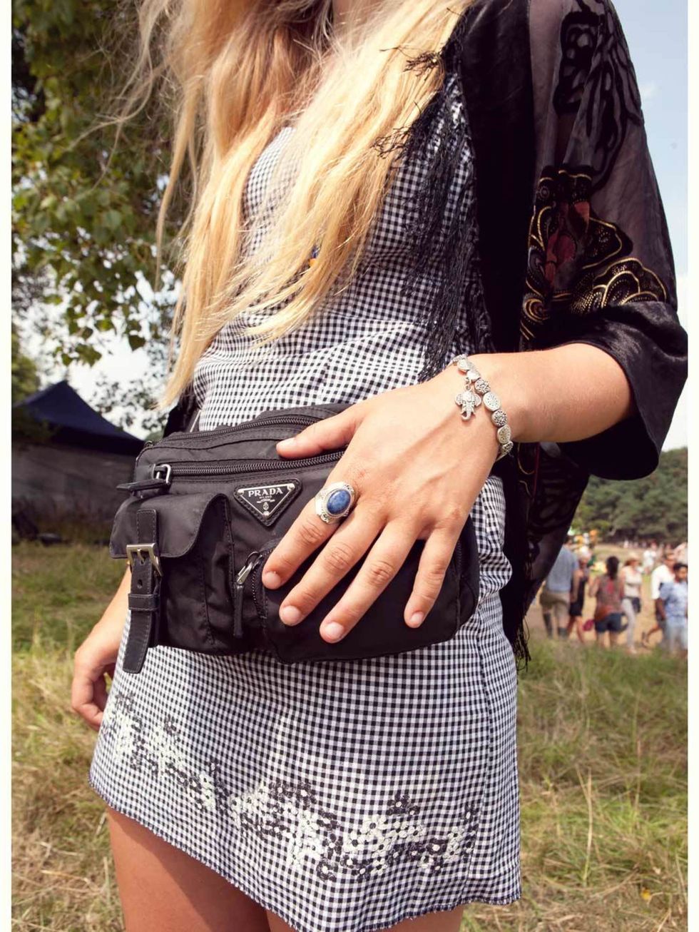 Stella Rozenbroek-Vinken wears Prada bag, vintage dress and kimono, elephant bracelet and Lapis Lazuli ring from Brighton pier.
