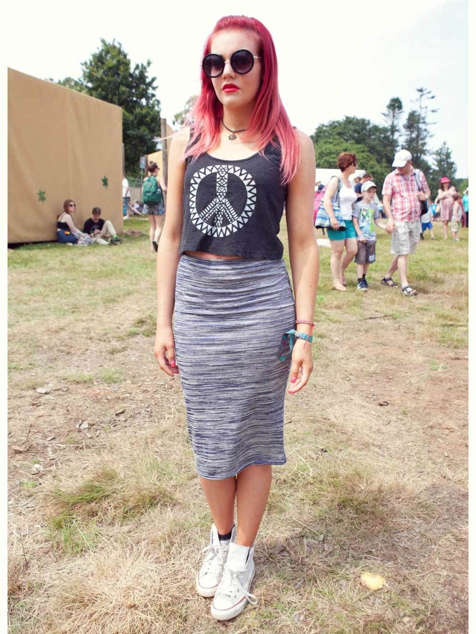 Emily Kerr wears New look skirt, Topshop crop top, Converse shoes, vintage sunglasses.