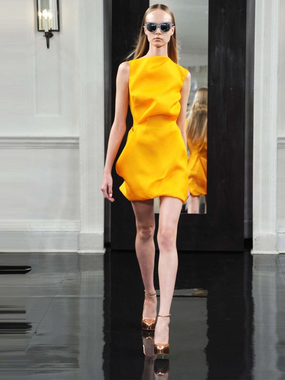 <p><a href="http://www.elleuk.com/catwalk/designer-a-z/victoria-beckham/spring-summer-2011/collection">SS11</a></p><p>Such a gorgeous colour! Such a pretty dress! This is a colour that you would normally only wear with tanned skin in summer but here the m