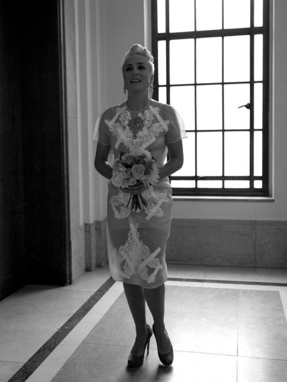 <p>My wedding dress was actually a two-piece skirt and top by Christopher Kane (SS13) in acid yellow with white lace applique, crystals and cellotape all over it. </p>

<p>The shoes were turquoise suede concealed platform pumps by Nicholas Kirkwood  a st