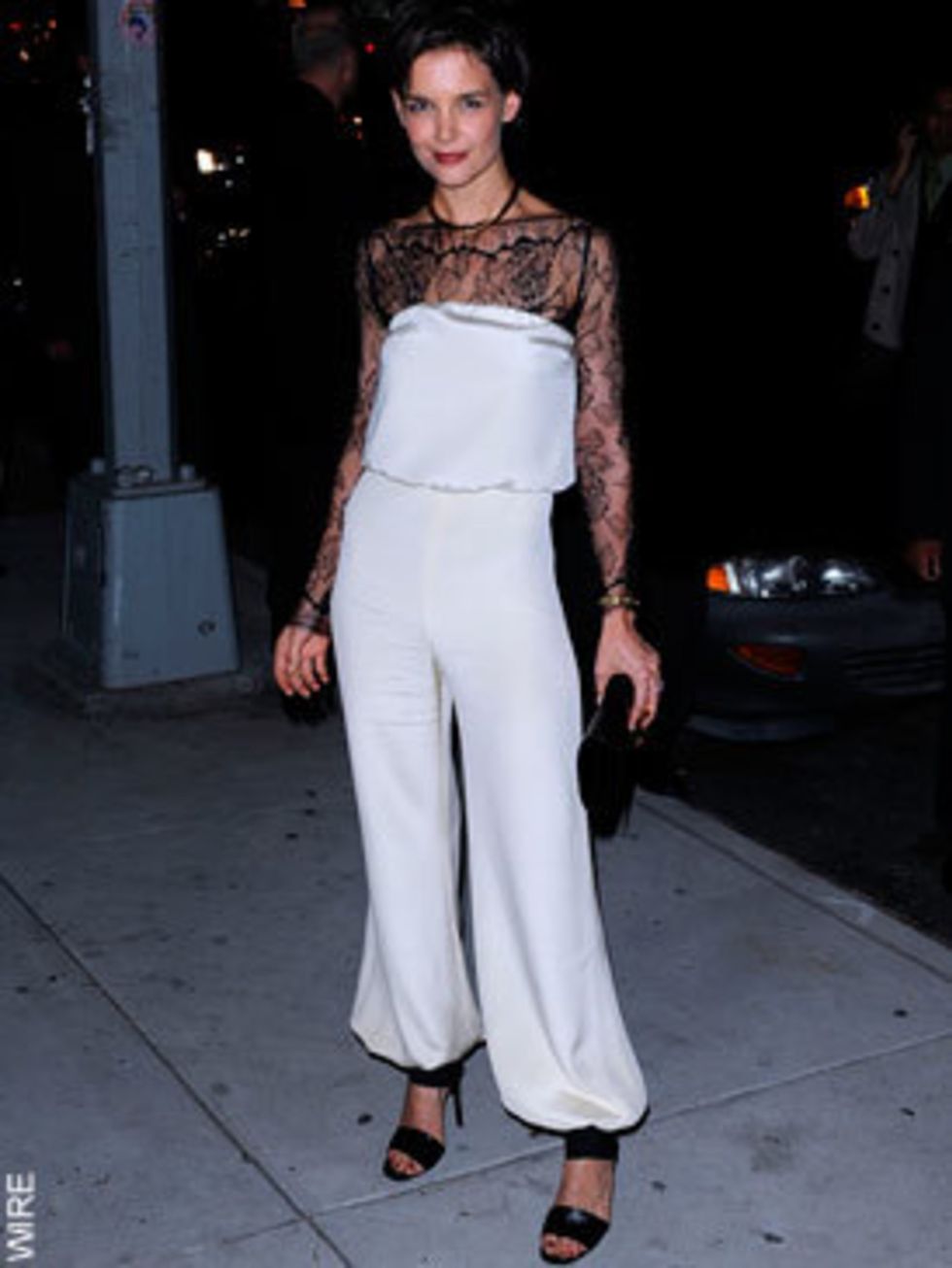 <p>Katie Holmes in a monochrome trouser gown</p>