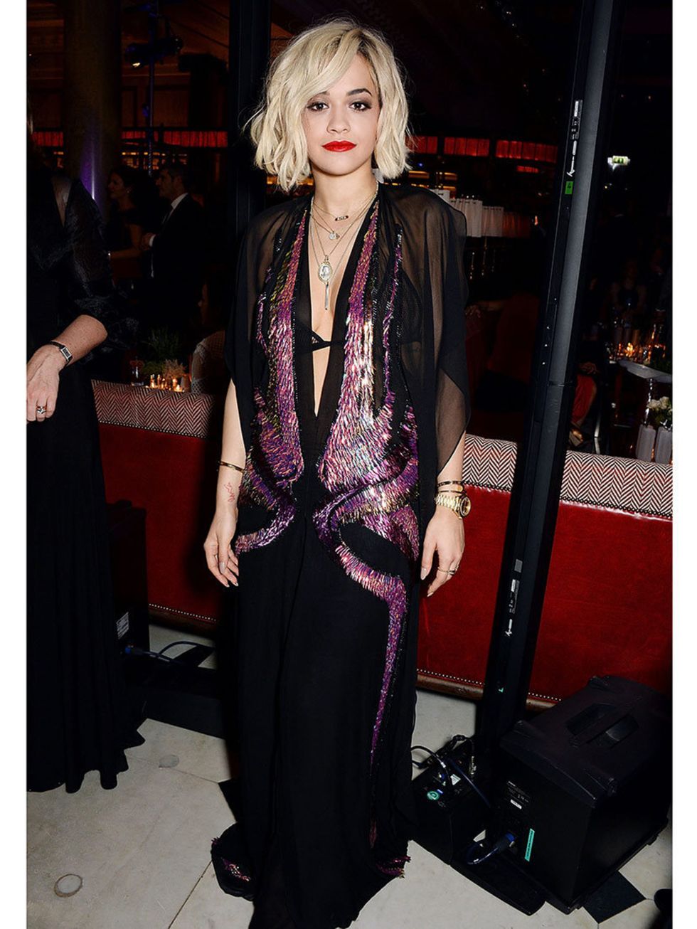 <p>Rita Ora wears a Gucci spring 2014 black chiffon halter gown to the post-bafta party, London, February 2014.</p>