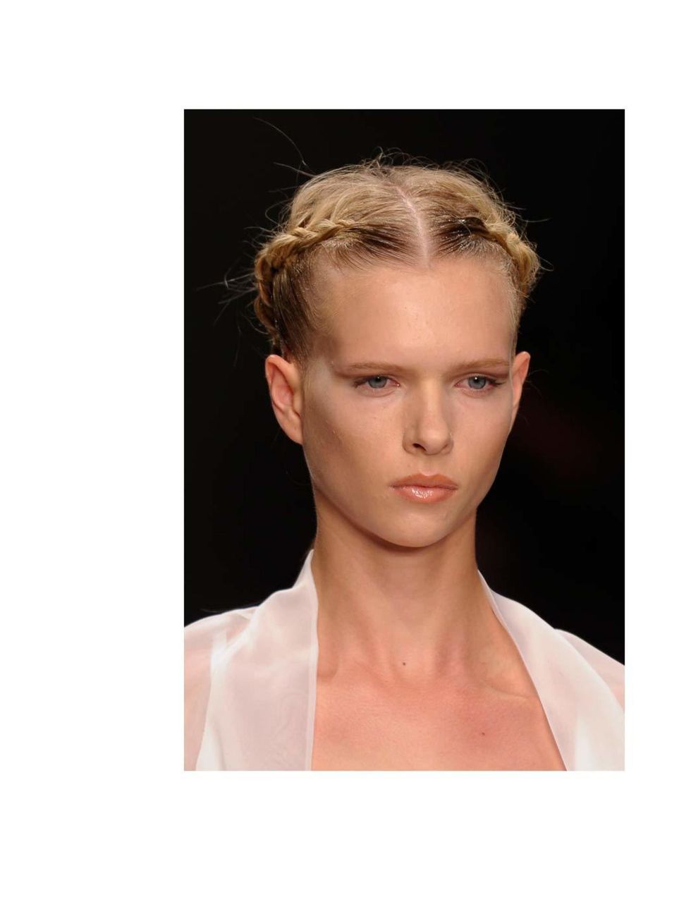 <p>Whether you bother to plait or twist the sides, its the little detail that distracts from any further dishevelment. When the rest of the hair is perfectly sleek, any <a href="http://www.elleuk.com/style/street-style/weather-proof-your-look">weather</a>