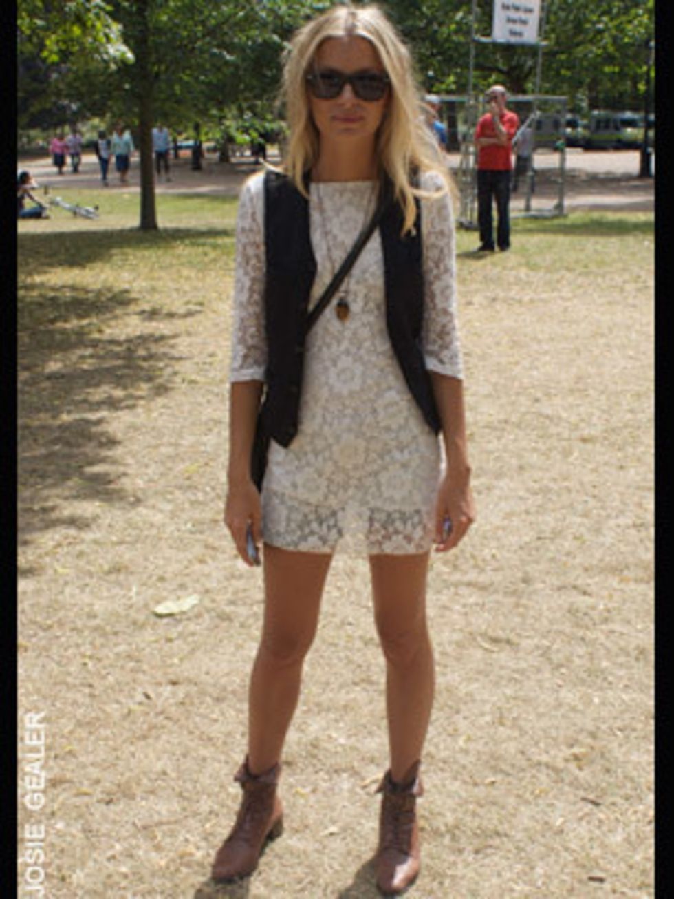 <p>Christina, 26, works in film, is wearing a cream lace dress brought from a shop in Brick Lane and a pair of vintage boots</p>