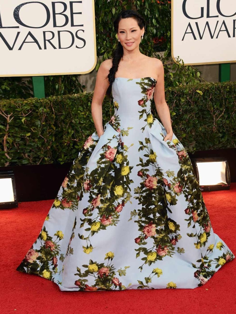 <p>Lucy Liu wore a floral print Carolina Herrera pre-fall 2013 gown at the Golden Globe Awards 2013.</p>