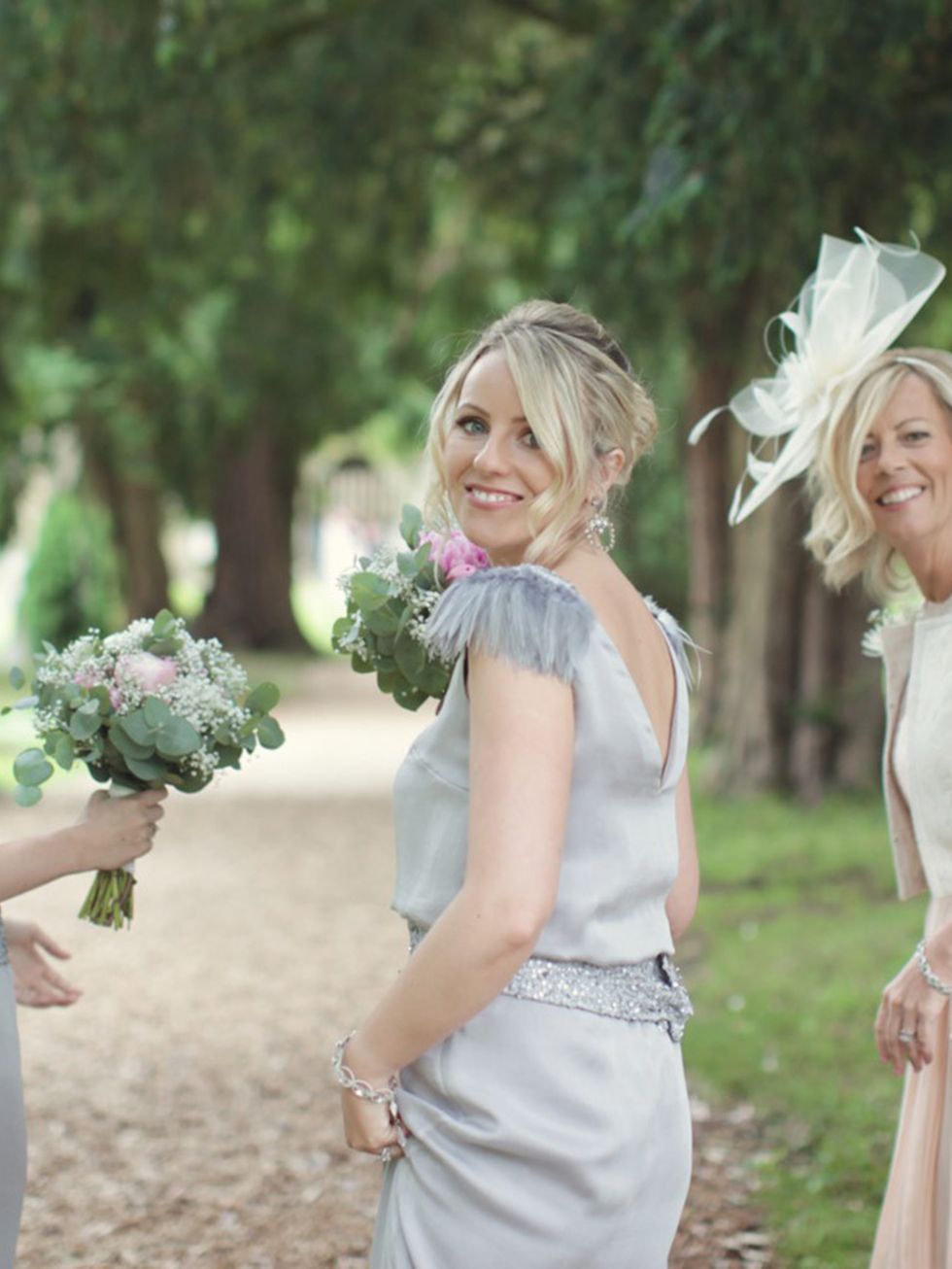 <p>My bridesmaids wore dresses created by designer <a href="http://www.foruminteriors.co.uk/amy-cook.html">Amy Cook</a>. They had a vintage art-deco look with capped feather sleeves, and were a beautiful dove grey.</p>