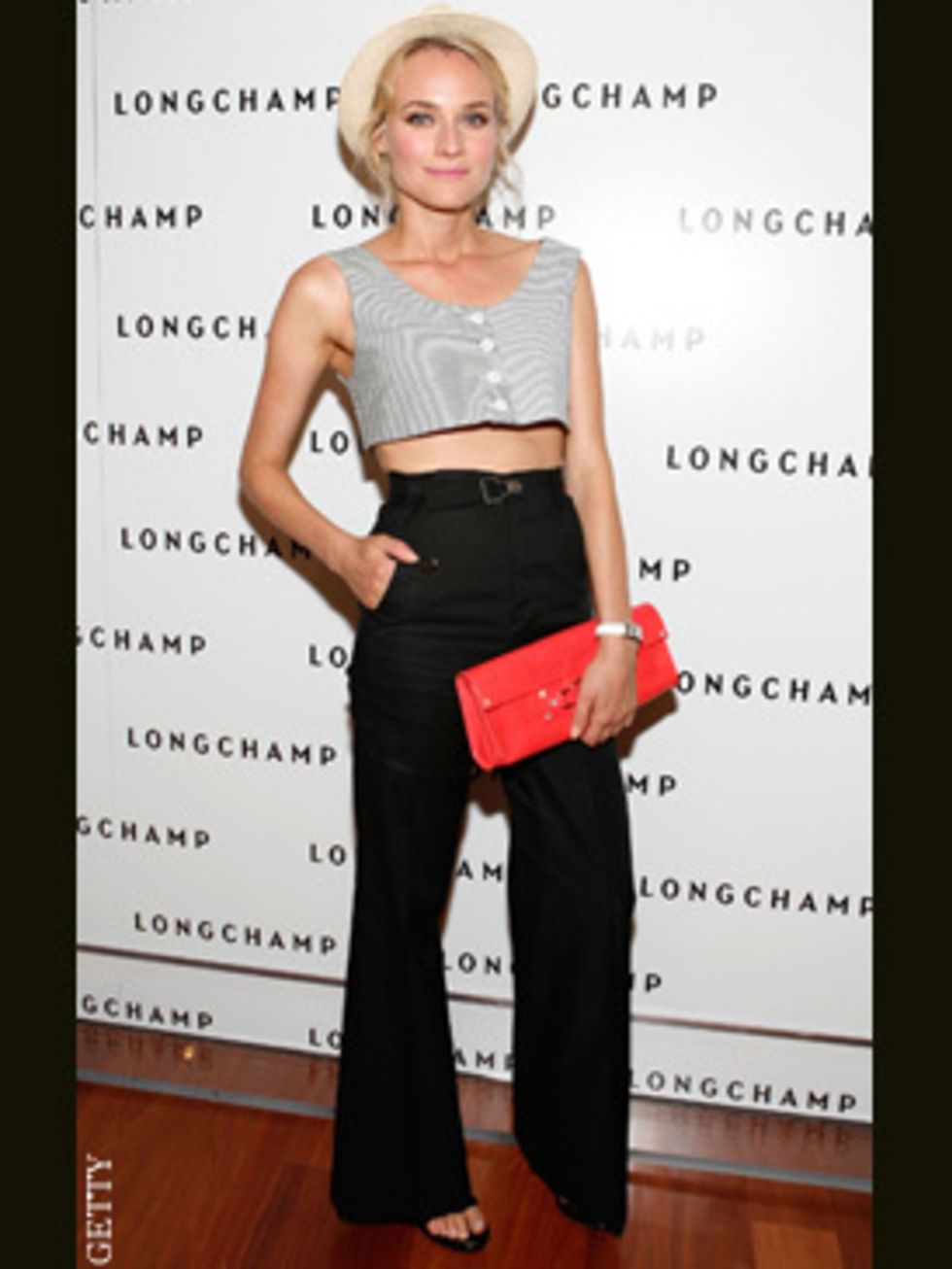 <p>Diane Kruger at a Longchamp anniversary party in an only she can get away with outfit of checked crop top and waisted trousers</p>