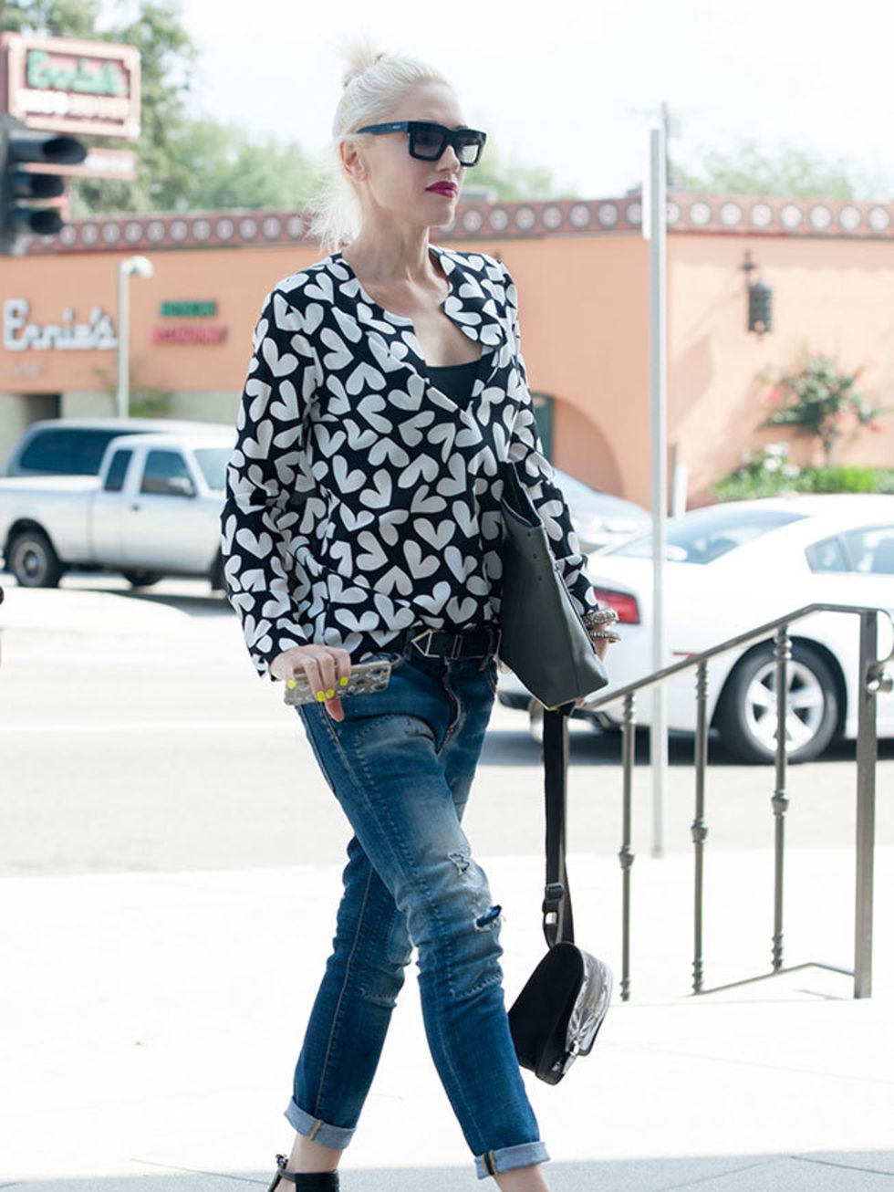 Gwen manages to make holding a phone and multiple bags look cool.