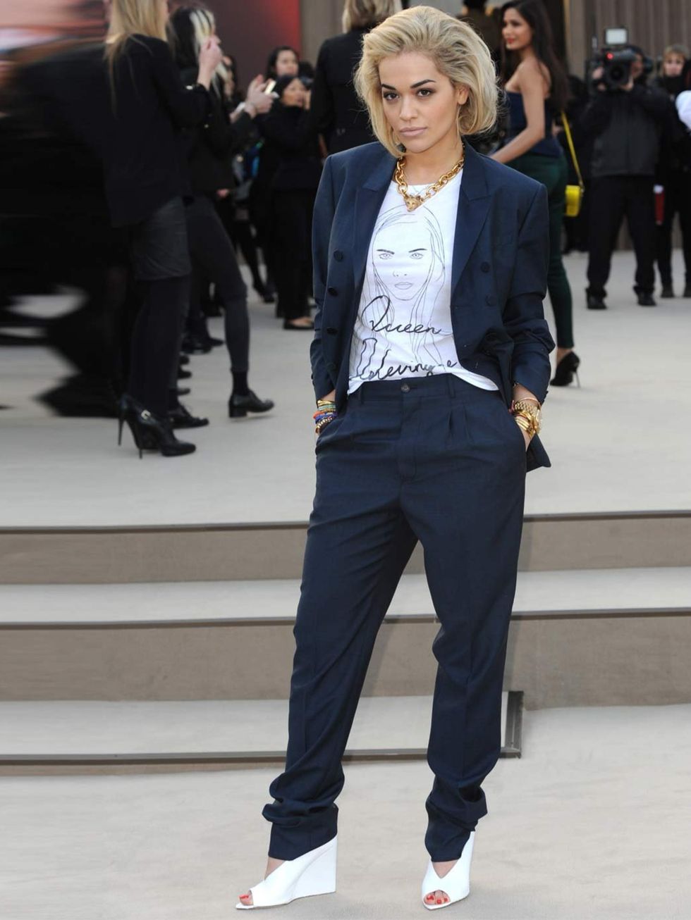 <p>Rita Ora wears a t-shirt with Cara Delevingne's face drawn onto it at the Burberry show, London.</p>