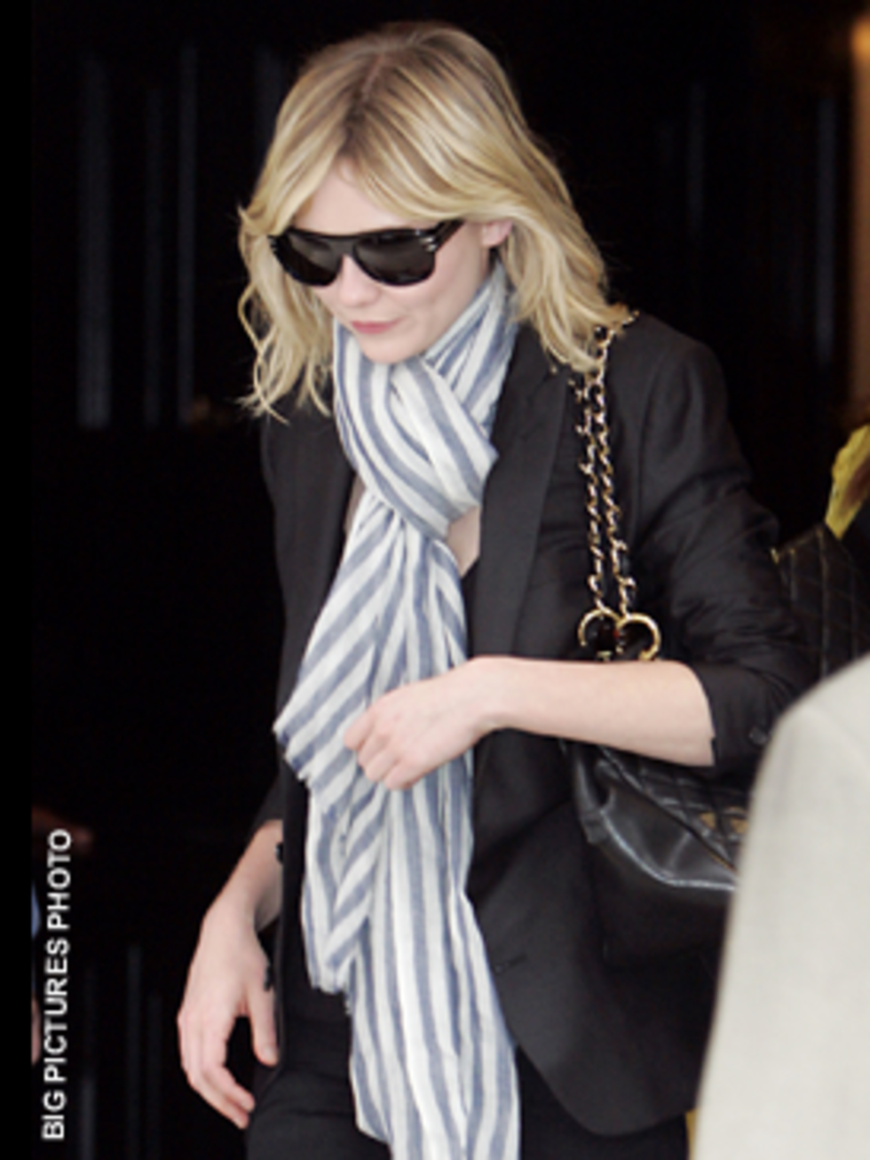 <p>The navy blazer, candy stripe scarf and retro shades work well to exude Kirsten's laid-back, yet kooky, Californian style</p>