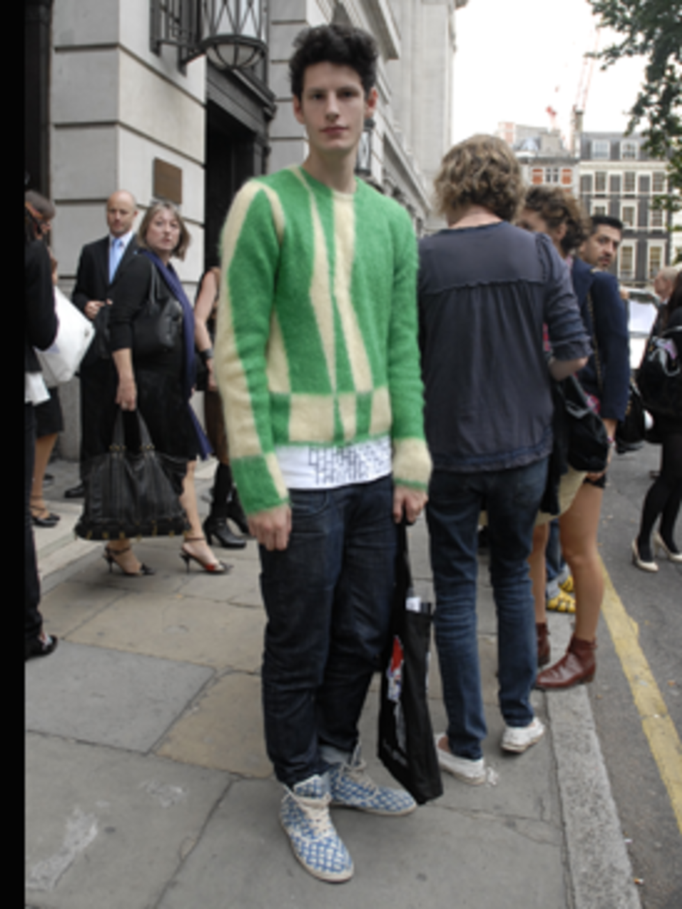 <p>Tom was flaunting a Prada-esque jumper and retro boots with a curious fish scale print at Bloomsbury Square before the Marios Schwab show.</p>