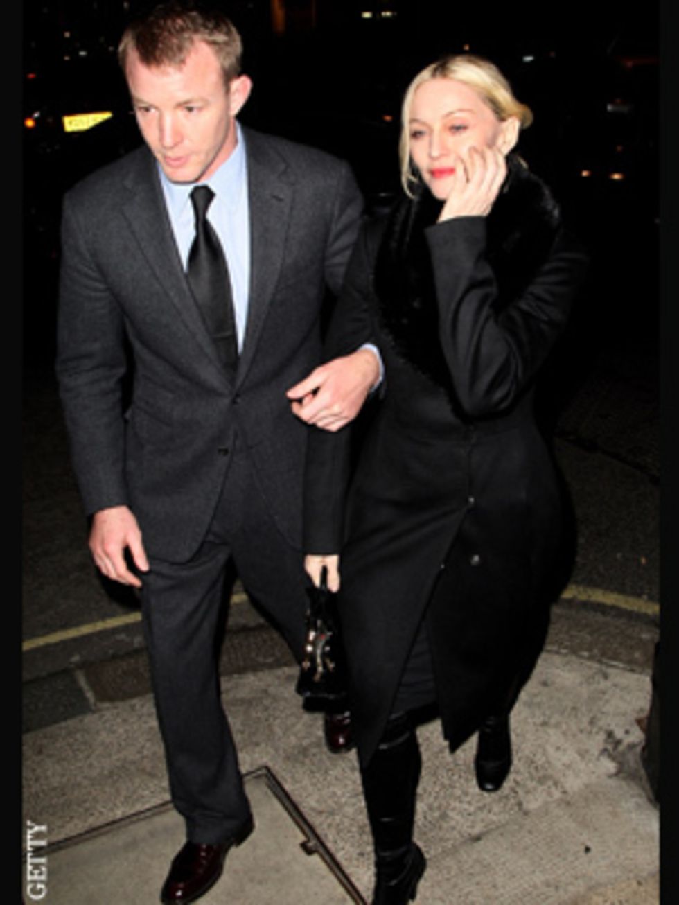 <p>Her husband, and a smile are all the accessories Madonna needs on a night at Harry's bar in London</p>