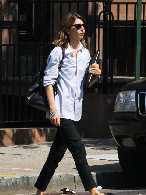 <p>Sofia Coppola wears skinny black trousers and boyish shirt while out in New York, 12th September 2011.</p>