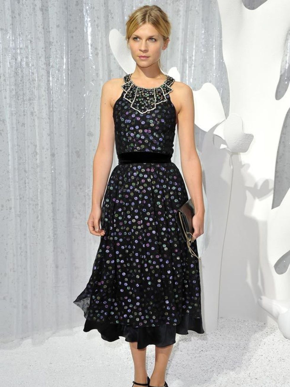 <p>Clemence Poesy wears this <a href="http://www.elleuk.com/catwalk/collections/chanel/">Chanel</a> polka-dot halter dress with bejewelled neckline, <a href="http://www.elleuk.com/catwalk/collections/miu-miu/">Miu Miu</a> shoes and metallic clutch for the