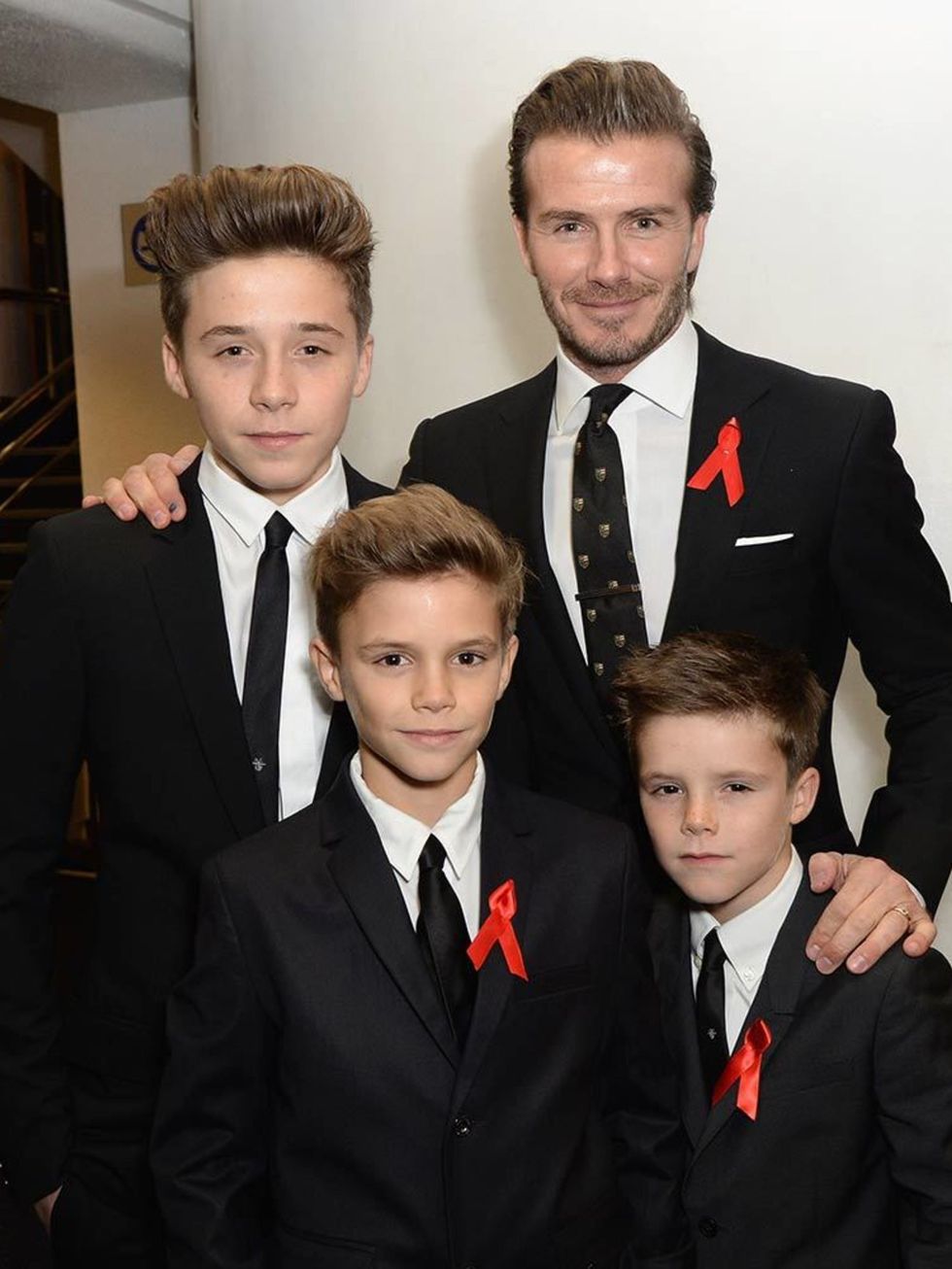 Brooklyn with his brothers and dad, David, at The Class of '92 film premiere 2013