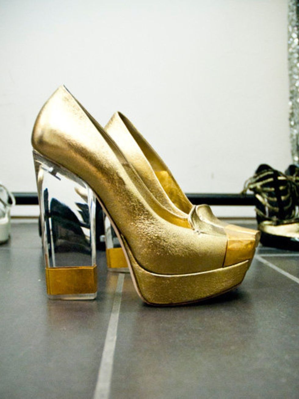 <p>Gold McQueen shoes called in for the Jessie J cover shoot.</p>