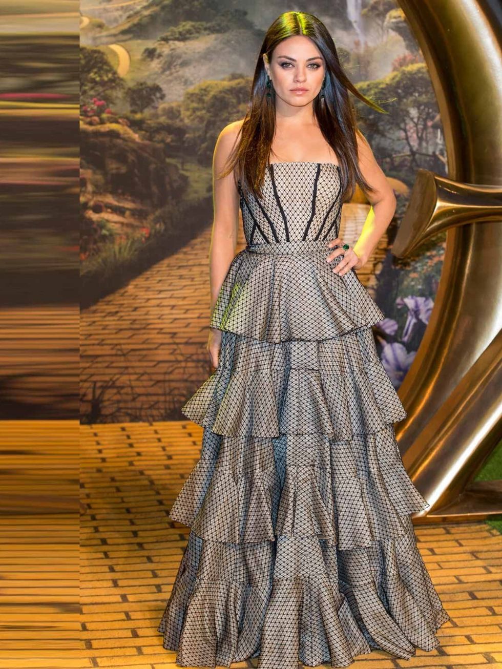 <p>Mila Kunis wears Alexander McQueen gown to the European premiere of Oz: The Great and Powerful, London, February 2013.</p>