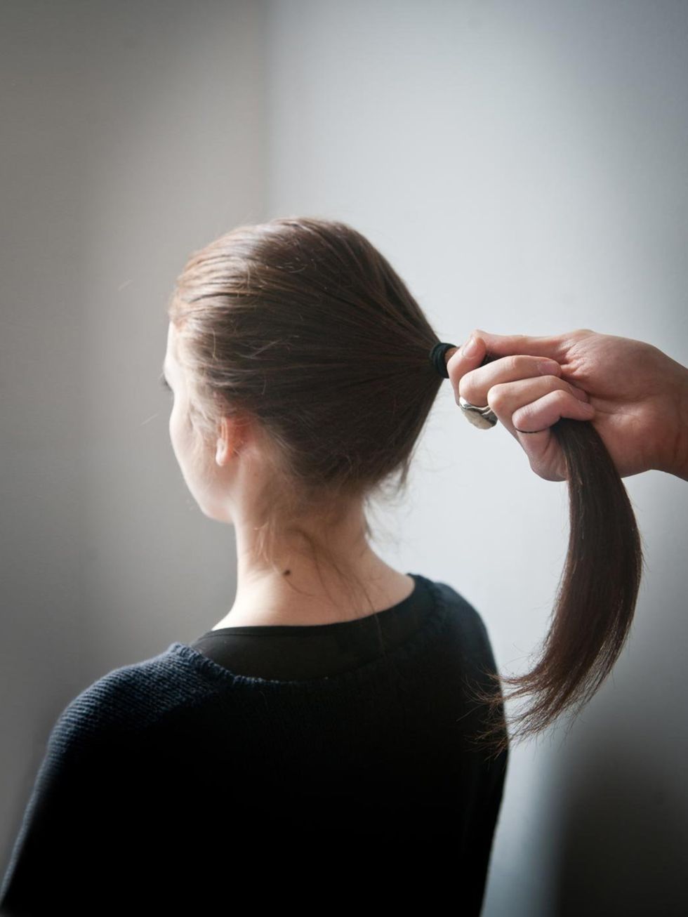 &lt;p&gt;Pull your hair into a pony just below the crown and tie with a hair elastic. Make sure the ponytail is not secured too tight to the roots.&lt;/p&gt;