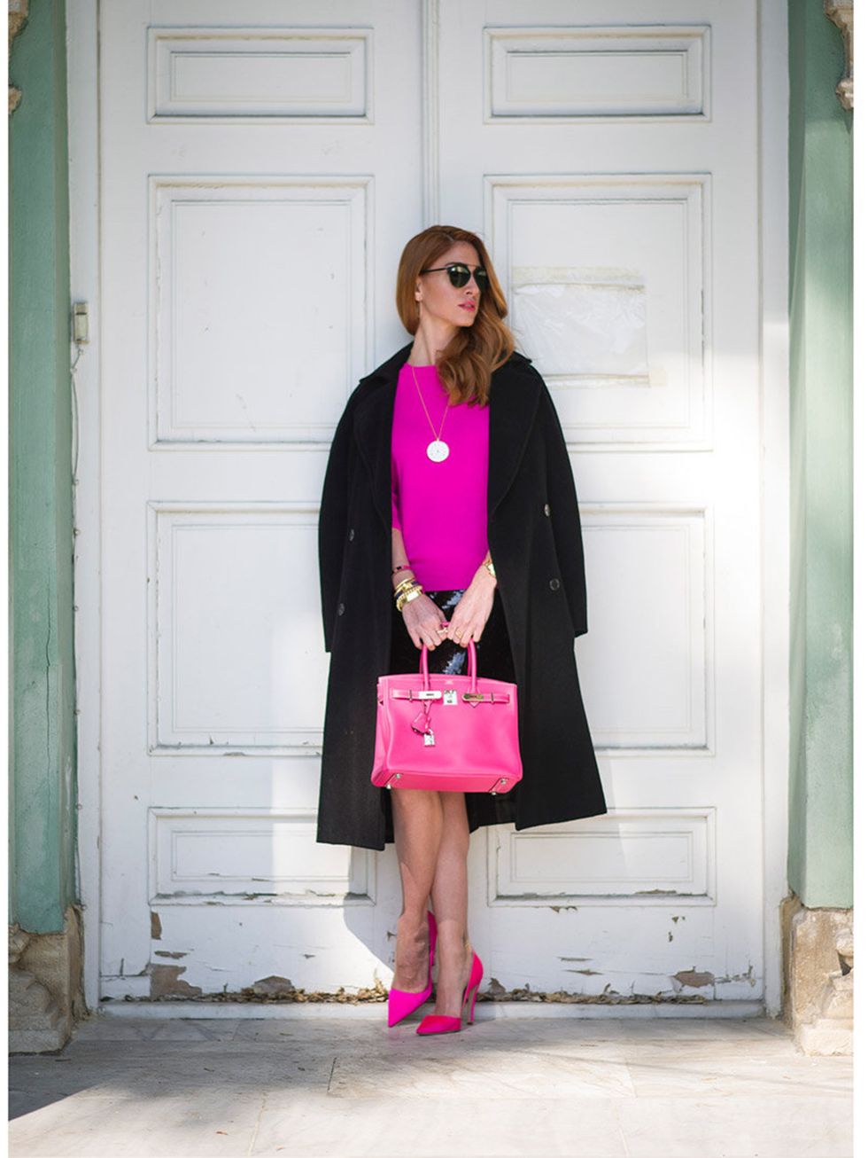 <p>Hande Yuece wears Max Mara coat, a vintage skirt, J.Crew top, Hermes bag, Ulseven shoes with jewellery from Cartier, Dior sunglasses </p>