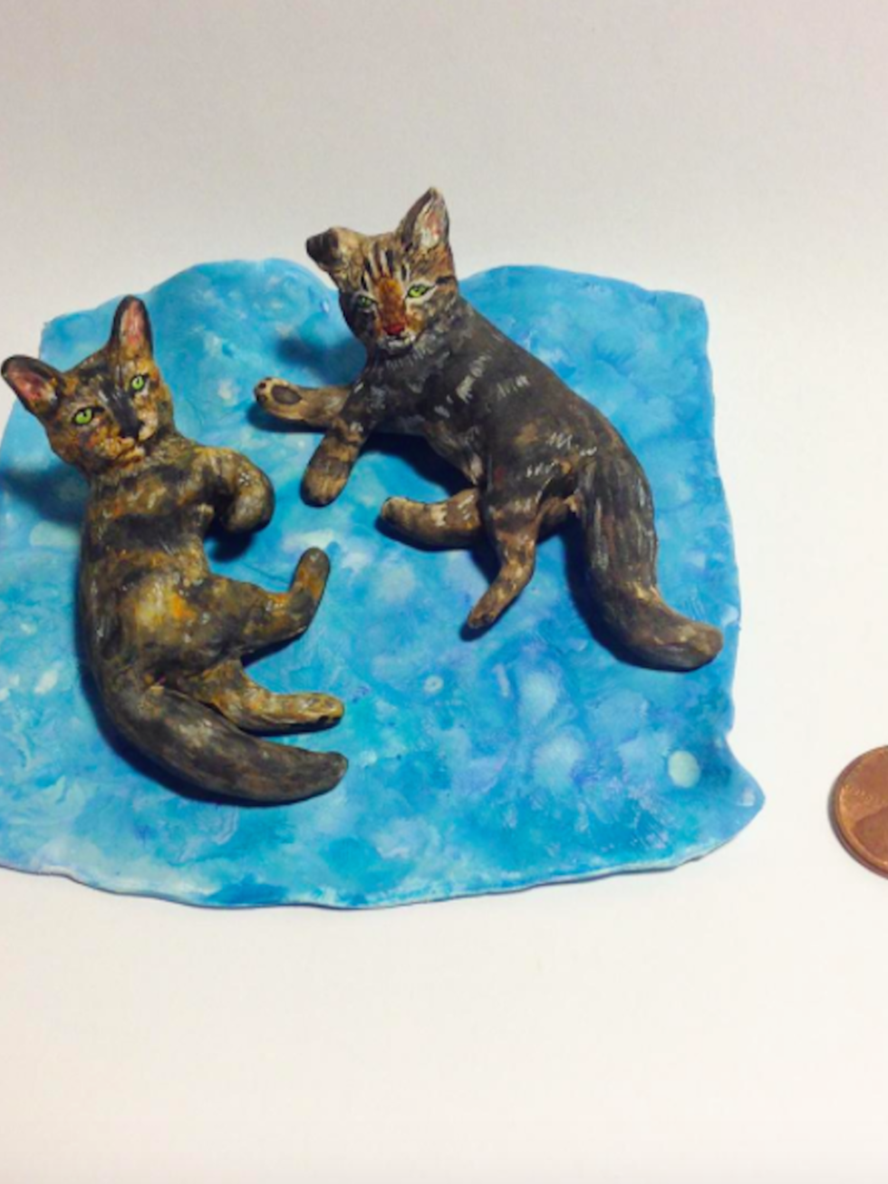 <p>Mackenzie McAlpin is a sculptor who creates miniature versions of people's pets, as well as mini models of food. We're now convinced we need a cat. </p>