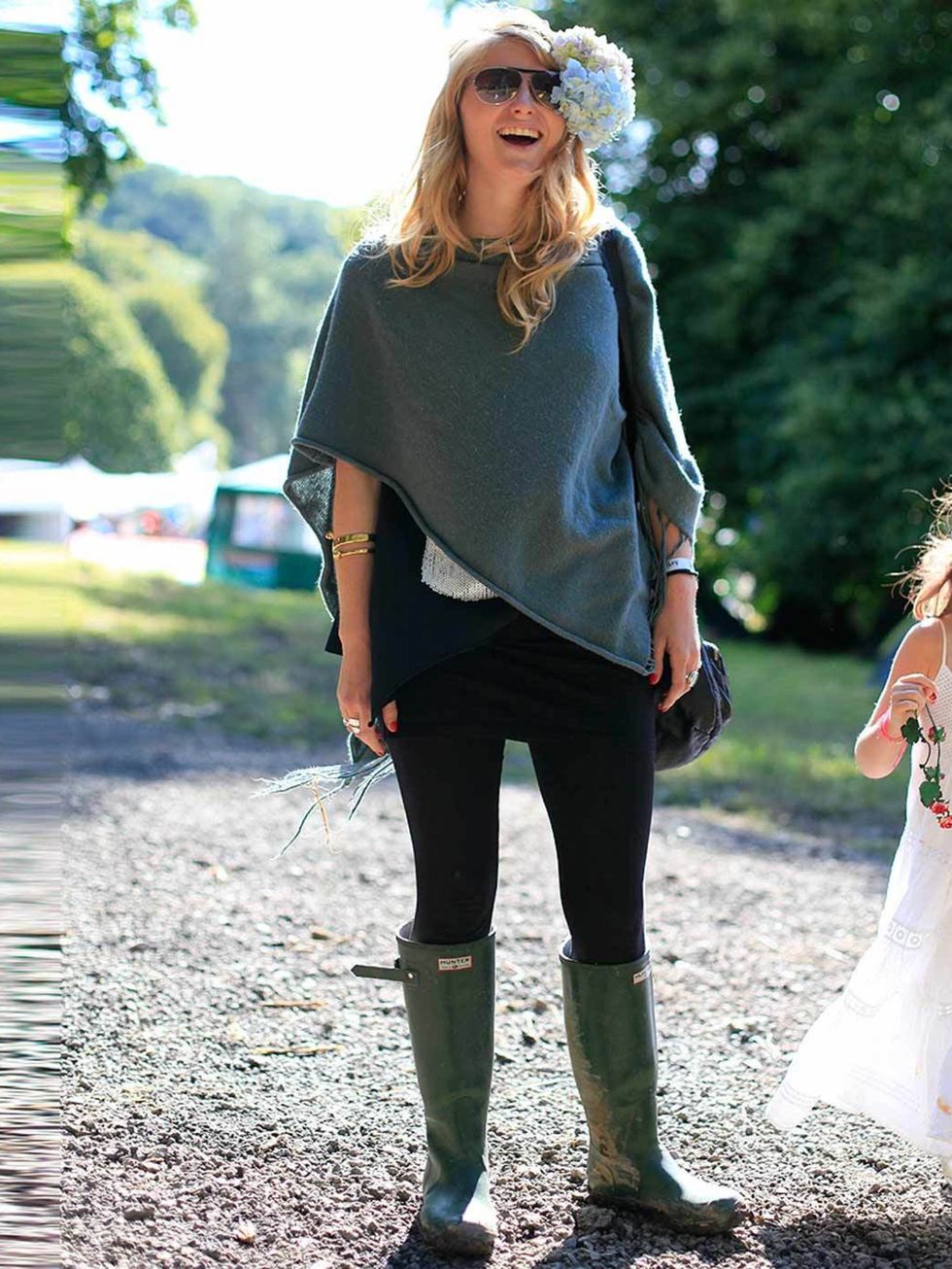 <p>Annabell Norbury, 25, Actress. Whistles poncho, top from Thailand, Hunter wellies, H&amp;M bag, Alexander McQueen bangle.</p>