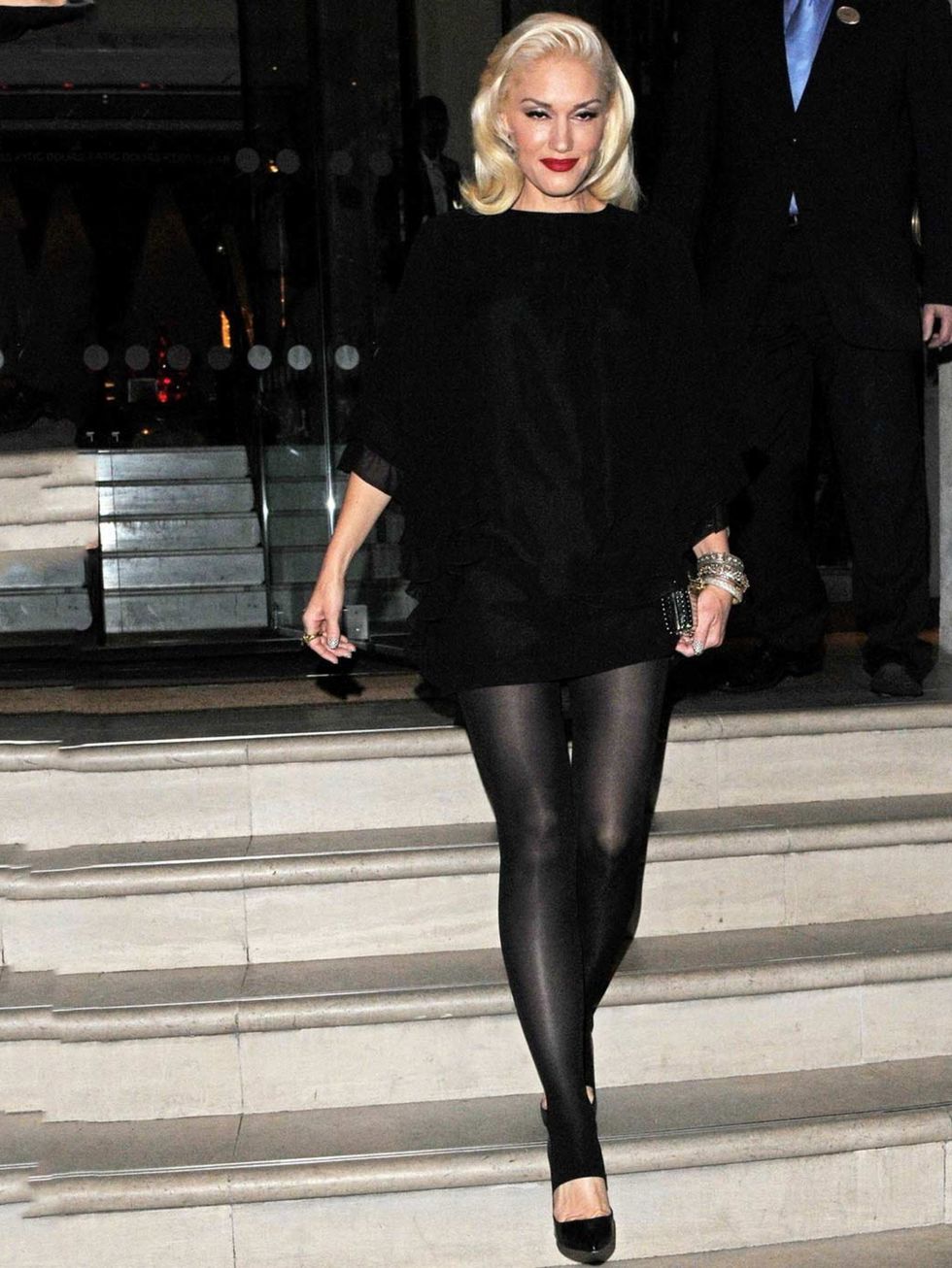 <p>Gwen Stefani teams her leather trousers with oversized knit, a lick of red lipstick and perfectly coiffed hair whilst out in London, September 2012.</p>