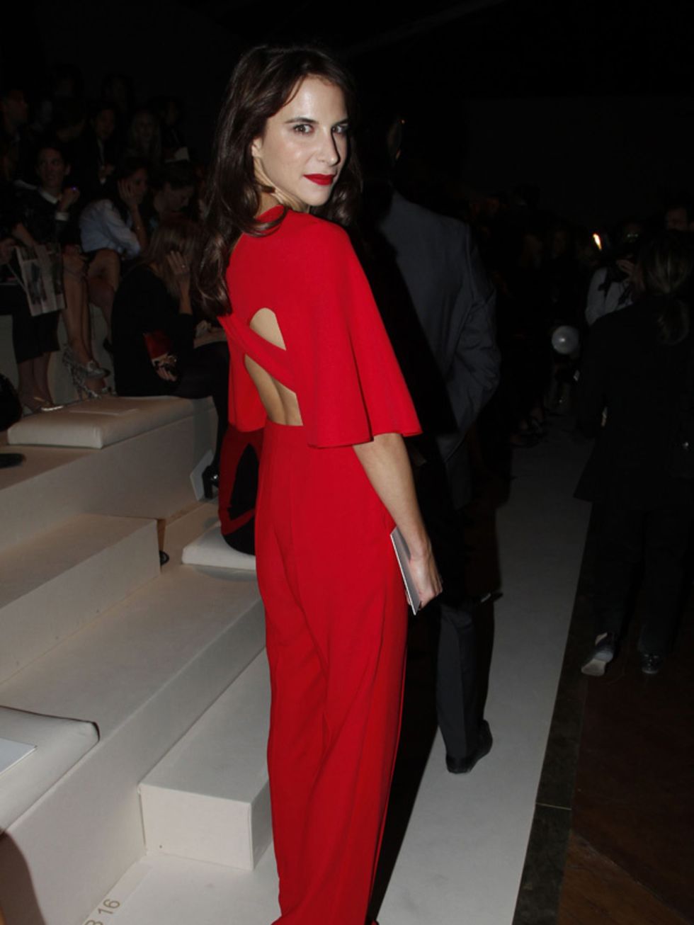 <p>Caroline Sieber is wearing an open back catsuit to the Valentino Spring/Summer 2012 show during Paris Fashion Week, October 2011.</p>