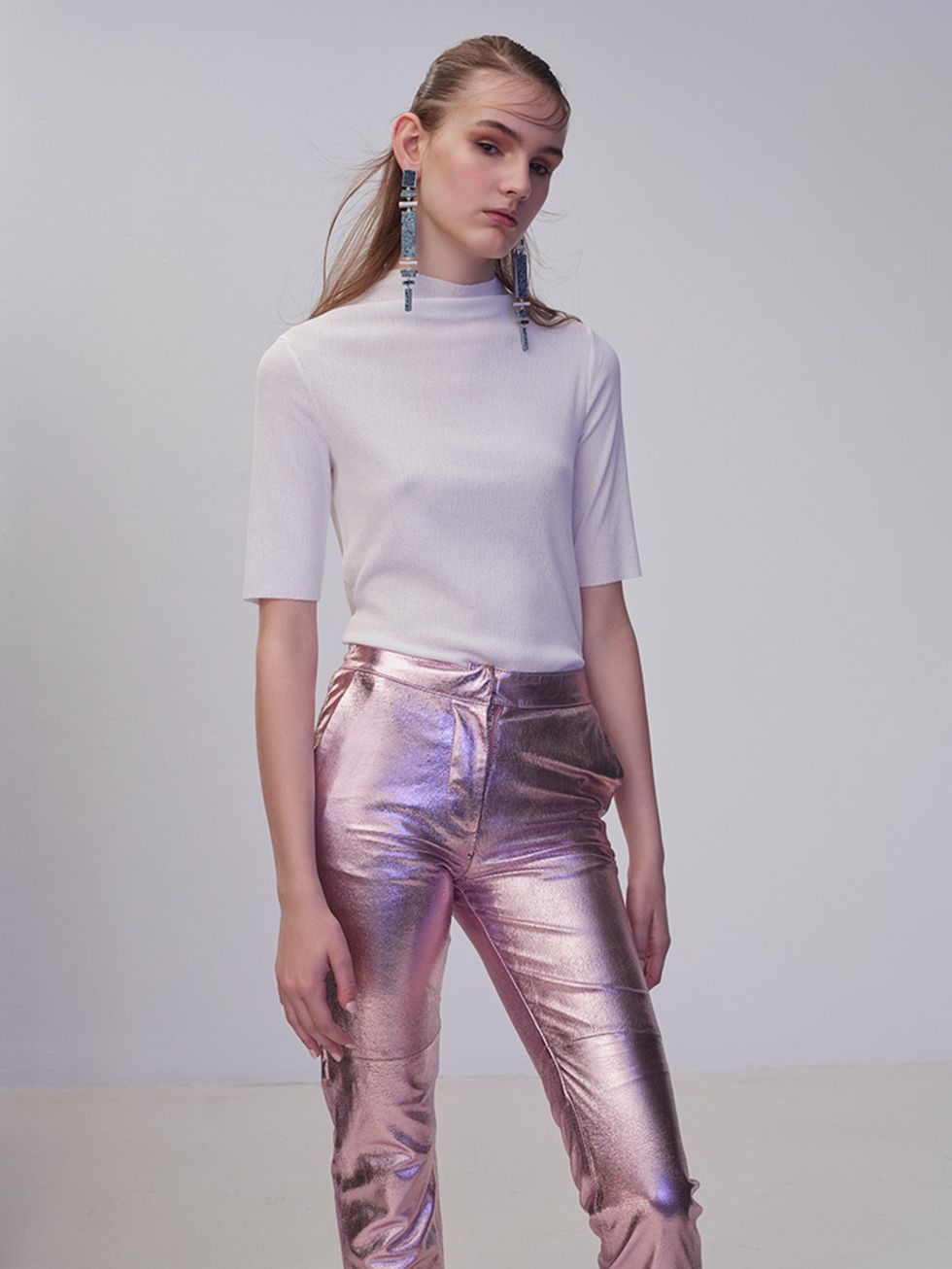 <p>Make metallic trousers work for daytime by pairing them with a simple white T-shirt and minimal make-up.</p>

<p><a href="http://www2.hm.com/en_gb/productpage.0355065001.html" target="_blank">Cotton top, £12.99, H&M</a>. Leather trousers, £345, Paul & 