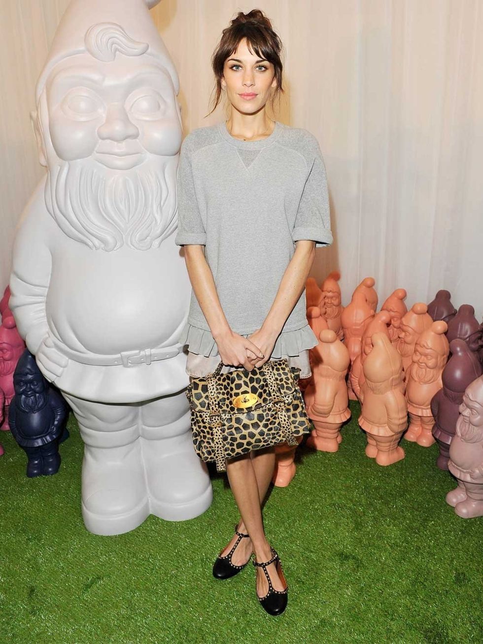 <p>Alexa Chung wore a Mulberry velvet tee and lace trim shorts, with a pair of Eliza T-Bar Ballerinas to the Mulberry SS13 show.</p>